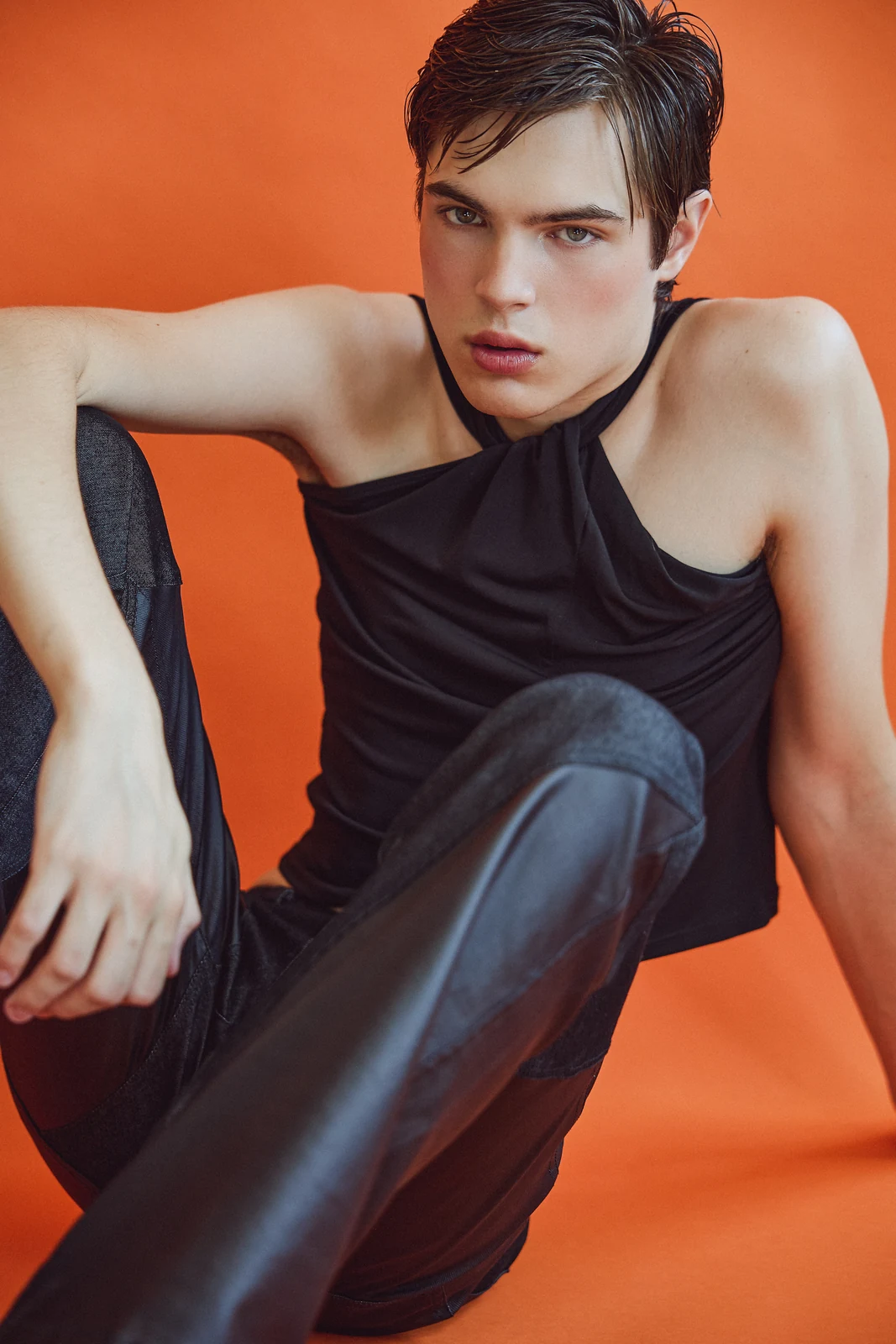 Black halter look against orange for MMScene August 2026 — styling by Manel Guisado